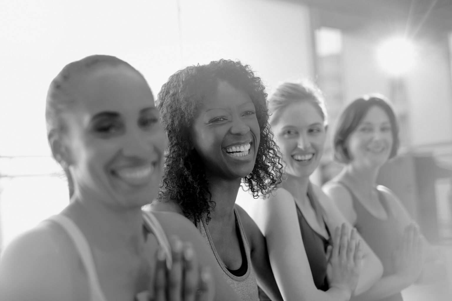 Members laughing together after a class at Nation Performance