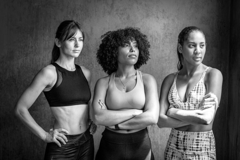 Three members standing together after training
