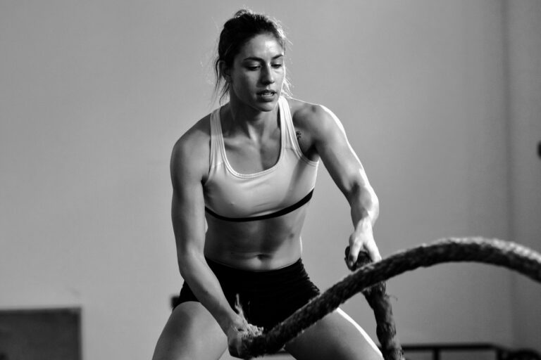 A member working the battle ropes