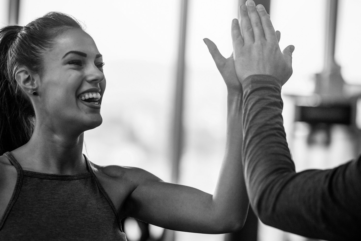 Two members high fiving after a session